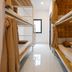 Mai Vy Guest House in Ho Chi Minh City dorm room with bunk beds and a bright window