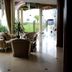 Mawlamyine Strand Hotel lounge with striped seating and garden views in Mawlamyine