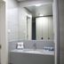 Hi Rabin - Jerusalem Hostel bathroom vanity with mirror and tiled shower, Jerusalem