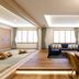 Kitayuzawa Mori no Soraniwa in Date: spacious suite with tatami area, sofa, and modern dining table