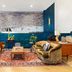 Arrive Memphis lounge with teal walls, vintage sofas and a large aerial mural in Memphis