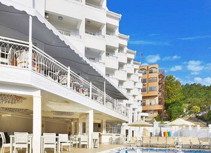 Ideal Pearl Hotel Adults Only in Marmaris with outdoor pool, sun loungers and white balconies