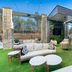 Embassy Suites by Hilton Raleigh Durham Airport Brier Creek outdoor patio with seating and artificial turf in Raleigh