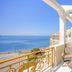 Electra Palace Thessaloniki balcony with sea view, chairs and small table overlooking the beach