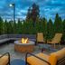 Home2 Suites by Hilton Saratoga Malta patio with fire pit and seating under cloudy sky