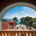 Hotel Cala del Pi - Adults Only in Platja d'Aro, sea view through arched window over pool and terraces