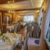 Flairhotel am Wörthersee in Velden am Wörthersee dining room with set tables and warm lighting