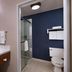 Fairfield by Marriott Inn & Suites Kansas City Airport bathroom with walk-in shower and vanity