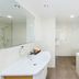 Fitzherbert Regency Motor Lodge bathroom in Palmerston North with bathtub, walk-in shower and vanity