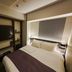 Grids Premium Hotel Osaka Namba guest room with double bed and wall-mounted TV in Osaka