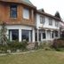 Hosteria Las Amapolas in San Carlos de Bariloche, rustic lodge exterior with wood and stone facade