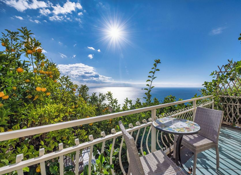 Locanda Degli Agrumi in Conca Dei Marini with sea-view terrace, table and chairs overlooking the coast