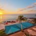 Coral Princess Hotel & Dive Resort in Cozumel with oceanfront pool and sunset beach view