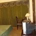 Hotel Airport Centre Point, Nagpur guest room with bed, desk, chair and TV