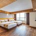 Yashshree Mall Road Darjeeling room with twin beds and large window in Darjeeling