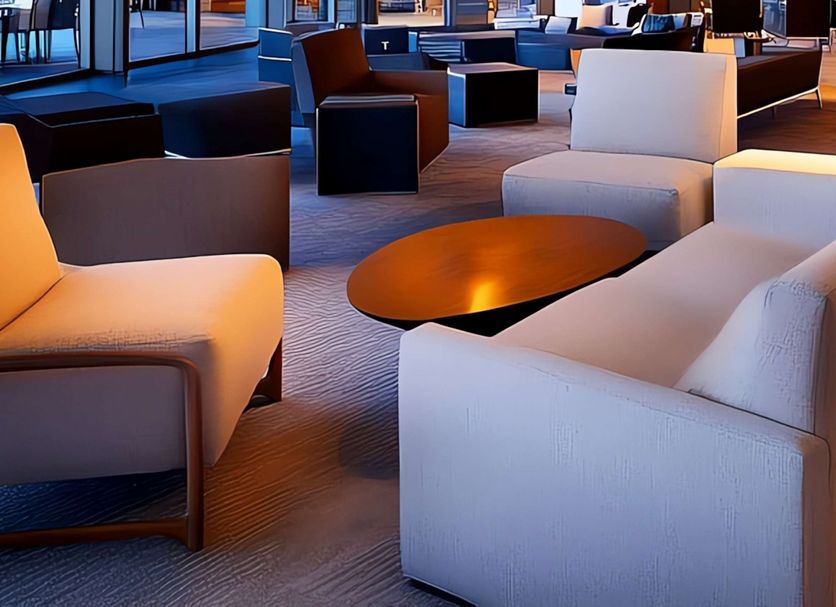 Days Inn by Wyndham Rock Falls lobby seating area with modern chairs and tables