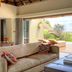 Four Seasons Safari Lodge Serengeti suite with open terrace and panoramic Serengeti savanna views