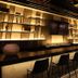 Origen 438 Luxury Boutique Hotel in Guadalajara bar with high stools and backlit shelving