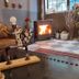 Rumours Inn Istanbul cozy lounge with wood-burning stove, sofa, armchair, and decorative accents