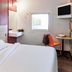 Hotelf1 Toulon Est la Valette room with bed, sink, desk, wall TV and window in La Valette-du-Var