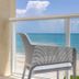 Ocean Breeze Inn Vero Beach balcony with chair overlooking the beach and ocean