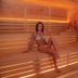 Villaggio Della Salute Più sauna interior in Monterenzio with woman seated on wooden benches