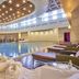 Rixos President Astana indoor pool with loungers and towel service in Astana