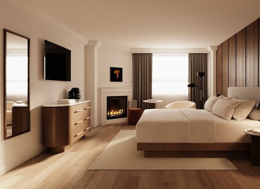 Metcalfe Montreal guest room in Montreal with a bed, fireplace, and window seating