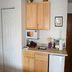 Yarmouth Resort in West Yarmouth kitchenette with microwave, sink, cabinets and mini fridge