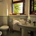 Le Rocche di Valiano bathroom with bidet, toilet, sink and open window in Vagliagli