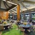 Hilton Garden Inn Kauai Wailua Bay in Kapaa: airy dining room with tables, high ceiling, and garden views