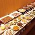 Hotel AZ Kumamoto Hokubu buffet table with assorted hot dishes, salads, and desserts in Kumamoto