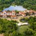 Aerial view of Grande Hotel e Termas de Araxá in Araxá surrounded by lush forest and lakes