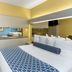Microtel Inn & Suites by Wyndham Stockbridge/Atlanta I-75 guest room with two beds and desk