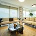Kamer Exclusive Hotel & Suites in Cesme living room with sofas, coffee table, and large windows