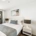 Rhapsody Resort Surfers Paradise hotel room with king bed and balcony ocean view