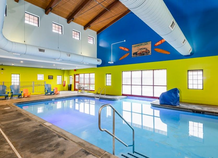 Stoney Creek Hotel Kansas City - Independence indoor pool with large windows and lounge chairs