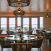Hillsboro Beach Resort By Kasa dining room with ocean-view windows and round tables in Hillsboro Beach