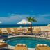 Solmar Resort, Cabo San Lucas: beachfront pool with lounge chairs, umbrellas, and ocean view