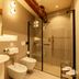 Hotel Villa Soligo bathroom with walk-in glass shower, bidet, and pedestal sink in Farra di Soligo