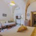 Masseria Casina Vitale in Ceglie Messapica guest room with arched stone ceilings and twin beds