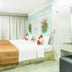Pratunam City Inn Bangkok guest room with twin beds, desk and wall art