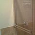 Arrowhead Mountain Inn Lake Arrowhead bathroom shower with glass door and tan tile