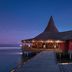 Anantara Veli Maldives Resort overwater restaurant and walkway at dusk in Veligandu Huraa