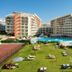 Ukino Palmeiras Village in Porches with pool, tennis court and sun loungers on the lawn
