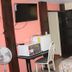 Acuarela Huasteca in Ciudad Valles room with bed, desk, TV, mini fridge, and fan