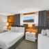 Lake Placid Inn: Residences guest room with two beds and lake view windows in Lake Placid