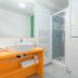 Appart'City Confort Tours bathroom with shower, sink vanity and toilet in Tours