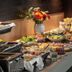 Ibis Styles Riga breakfast buffet with salads, pastries, fruit, yogurt and flowers