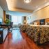 Hua Bin International Hotel Beijing twin beds and bright windowed guest room with wood floors